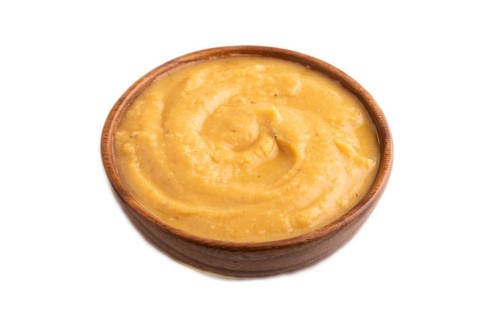 Pea cream soup, Puree, porridge in wooden bowl isolated on white background. Diet, healthy eating