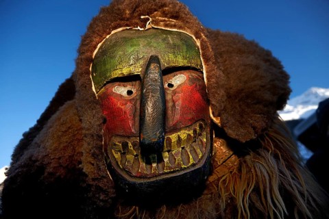 Portrait of traditional hand-carved wooden mask from the Loetschental Carnival, representing