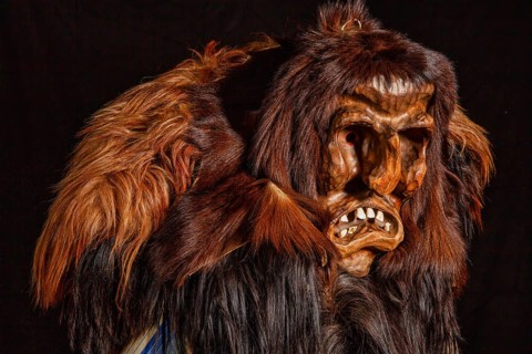 Portrait of traditional hand-carved wooden mask from the Loetschental Carnival, representing