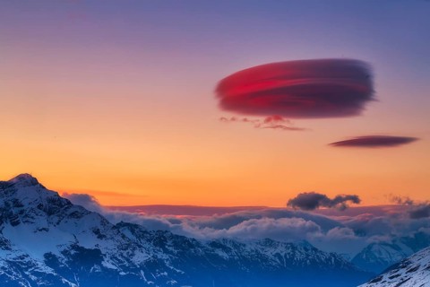 Lenticular clouds over Zermatt at sunset in winter, Valais, Switzerland