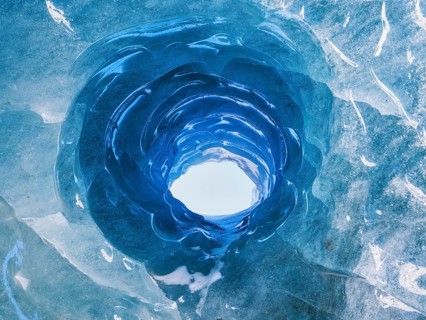 Hole in an ice cave, formed by melting and subglacial streams, Climate Change, Global Warming,