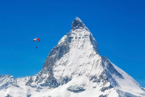 Winter paragliding near the Matterhorn, Zermatt, Valais, Switzerland