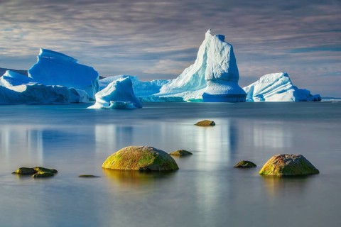 Icebergs floating in the bay near Ataa Village, Disko Bay, Arctic, Greenland, geographically part