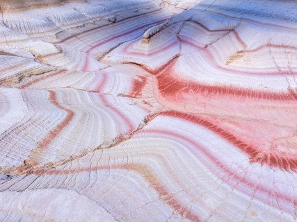 Sunset at Kyzylkup Hills (Tiramisu), colorful layered rock formations with red and white bands,
