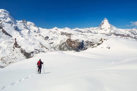 Snowshoeing in the Gornergrat region with views of the surrounding mountains and the Matterhorn,