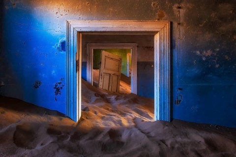 Sand dunes inside the houses of Kolmanskop ghost town, Karas Region, Namibia