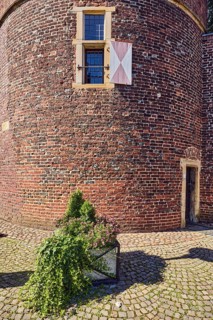 Thief tower, registry office, historic city prison, prison, brick building, façade with windows and