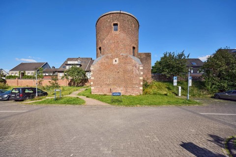 Holkensturm, historic city fortification, tower, parking lot with cars, residential building,
