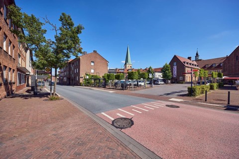 Residential building, brick building, general architecture, church tower of St. Remigius, sidewalk,