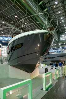 Press photo View of elegant bow of luxury yacht luxurious Sunseeker motor yacht in exhibition hall