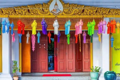 Decorated entrance to Wat Yannawa Buddhist temple decorated with colored lanterns, Bangkok,