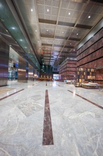 A spacious, minimalistic lobby with marble floors and modern furniture, London, England, United