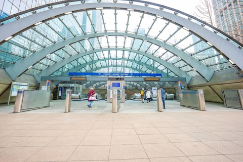 A modern building entrance with a glass roof and deserted escalators, London, England, Great