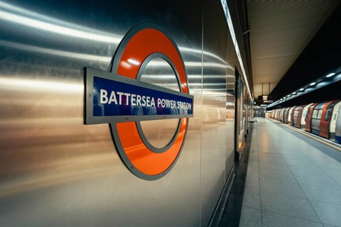 View of the Battersea Power Station subway sign on the wall in a modern train station area, London,