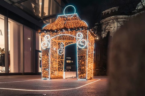 Brightly lit pavilion with festive Christmas decoration at night, London, England, Great Britain