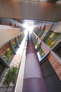 A symmetrical upward look between two modern buildings, London, England, Great Britain