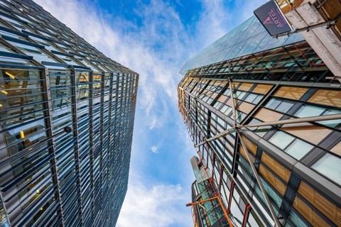 Two modern buildings reflected in the urban sky, London, England, Great Britain