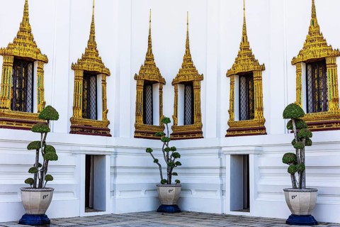 The Grand Royal Palace, richly decorated and gilded windows at the Dusit Maha Prasad throne hall,