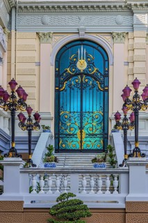 The Grand Royal Palace, side entrance with decorated gate and multi-armed lanterns, Chakri Maha
