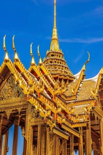The Grand Royal Palace, the gilded Abhorn Bimok Pavilion with overlapping roofs and curved chofas,