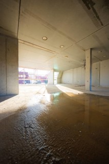 Unevenness and light reflections on the floor of an unfinished room, carpentry, renovation, roof