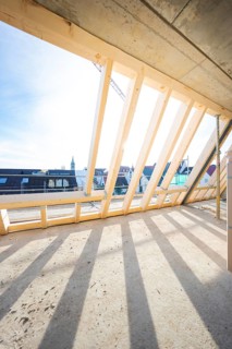 Roof truss with wooden structure and shade under sunny sky, carpentry, renovation, roof extension,