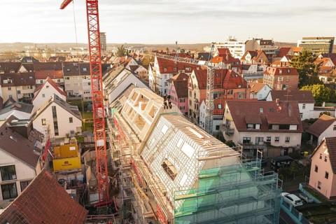 Panoramic view of urban construction on a roof with crane and scaffolding, carpentry, renovation,