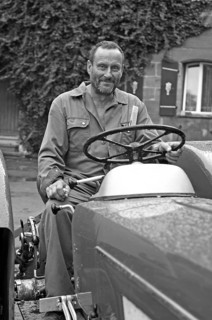 Farmer on his Schlüter tractor, black and white, Tauchersreuth, Middle Franconia, Bavaria, Germany