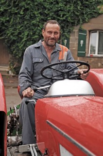 Farmer on his Schlüter tractor, Tauchersreuth, Middle Franconia, Bavaria, Germany