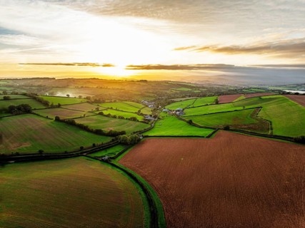 Colours of autumn Fields and Farms over Sheldon from a drone, Torbay, Devon, England, United