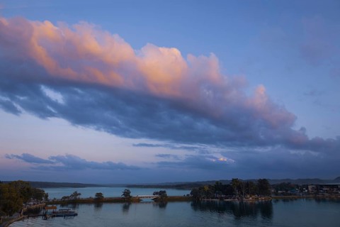 Scenic sunsets and colourful colonial architecture of historic center of Flores, Guatemala. View of