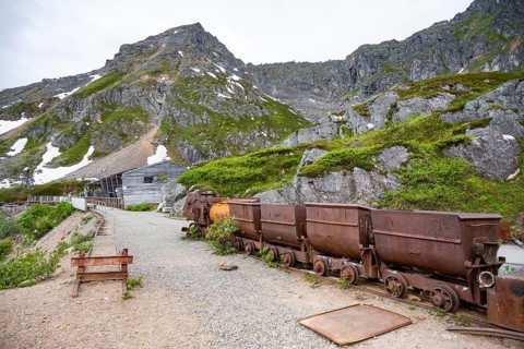 Old rusted mine trucks from the former Gold Mine Independence Mine in mountainous landscape,