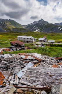 Crumbling mill and former Gold Mine Independence Mine building in mountainous landscape,