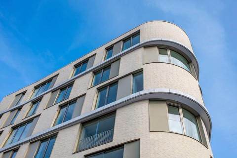 Modern building, detailed view of a residential building, apartment building with large glass