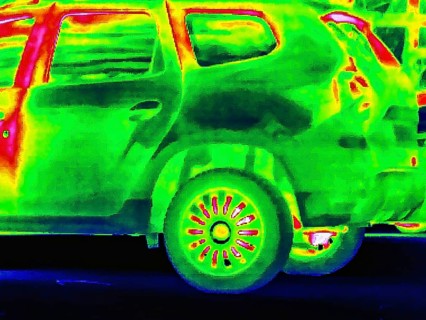 Thermal image or thermography, symbolic photo, interpolated. Car with higher temperatures in the