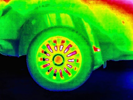 Thermal image or thermography, symbolic photo, interpolated. Car with higher pane and brake disc
