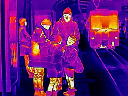 Thermal image or thermography, symbolic photo, interpolated. A family with children is waiting for