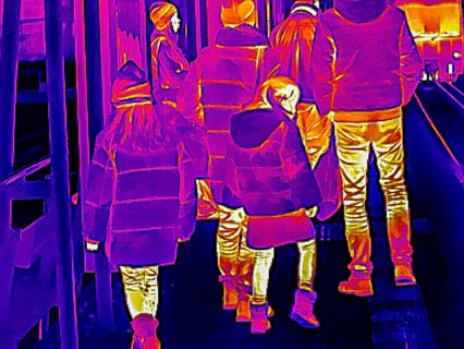 Thermal image or thermography, symbolic photo, interpolated. Family with children traveling in