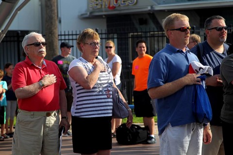 People at the entrance to the Kennedy Space Center during the national anthem, Merritt Island,