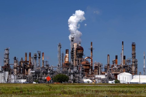 Large refinery plant with smoking chimneys and industrial structures, Mississippi Valley, USA