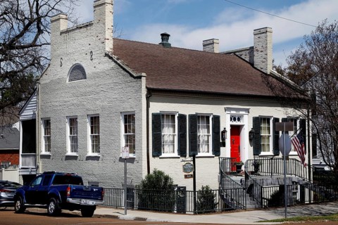 Historic house with red door in urban area, Natchez, USA