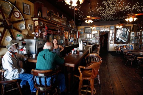 Rustic bar with cozy atmosphere and wooden furniture on Silver Street, Natchez, Mississippi, USA