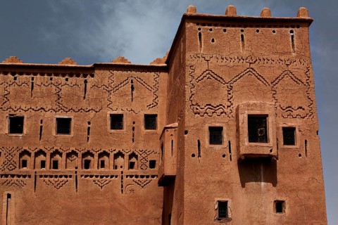 Detailed façade of Kasbah Taourirt with ornate patterns and traditional design, Ouarzazate,