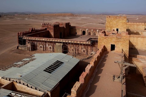 Panoramic view of a fortified complex in the desert, film set with extensive layout, Ouarzazate,