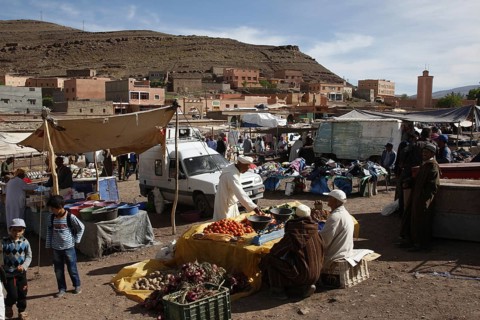 Lively market with numerous stalls and busy people in Msemrir, Msemrir, Region, MA