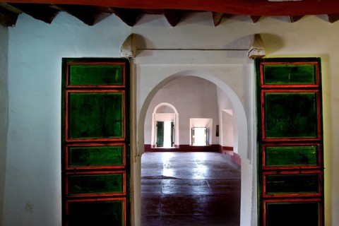 Interior view of a kasbah with colorful glass windows and arched doors, Ouarzazate, Kasbah