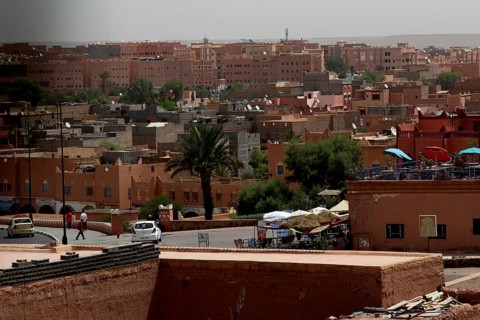 View of the city of Ouarzazate with palm trees and traditional architecture, Ouarzazate, Kasbah