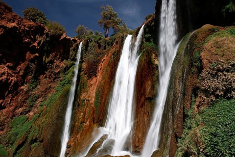 Majestic waterfalls of Ouzoud with thundering water surrounded by rocks and greenery, Ouzoud,