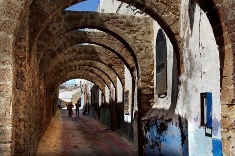 Archways with stone structure and atmospheric strips of light in the medina of Safi, Safi,