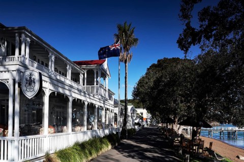 Duke of Marlborough Hotel in Russel, historic architecture with flag and palm trees, Russel,